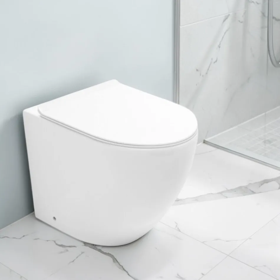 Vaso Wc a Terra Ciclonico con Sedile Soft Close in Ceramica Bianca - Aralia Viadurini